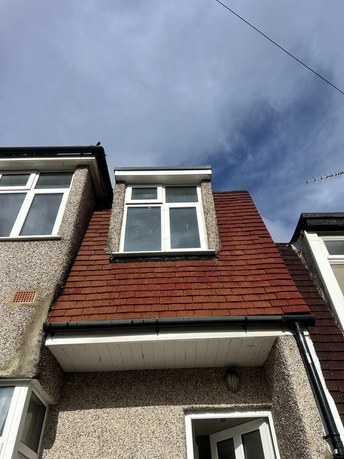 Clean white fascia, soffit and guttering on a Kent roofline