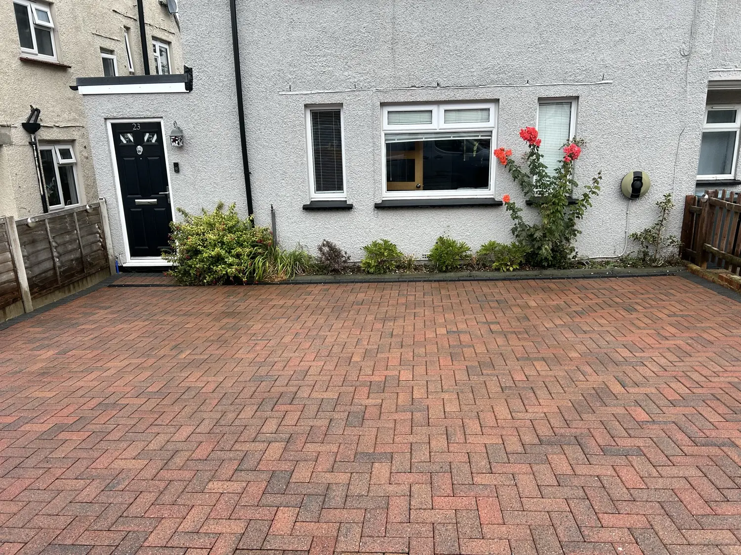 Freshly cleaned herringbone block driveway at a Kent property